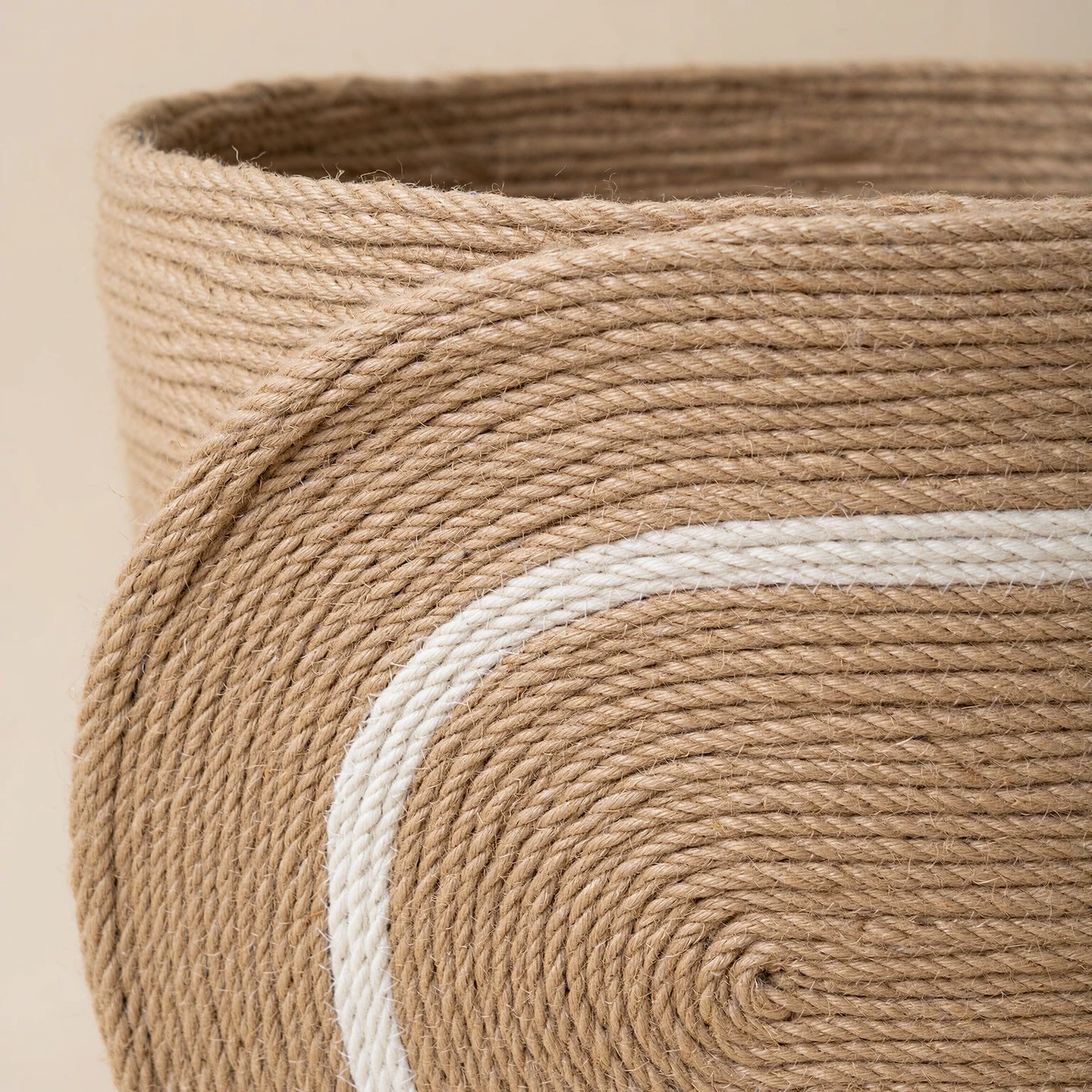 AI-edited texture study of coiled rope and the raised basket rim